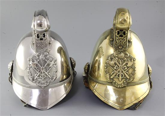 Two 19th century firemans helmets, height 10in.